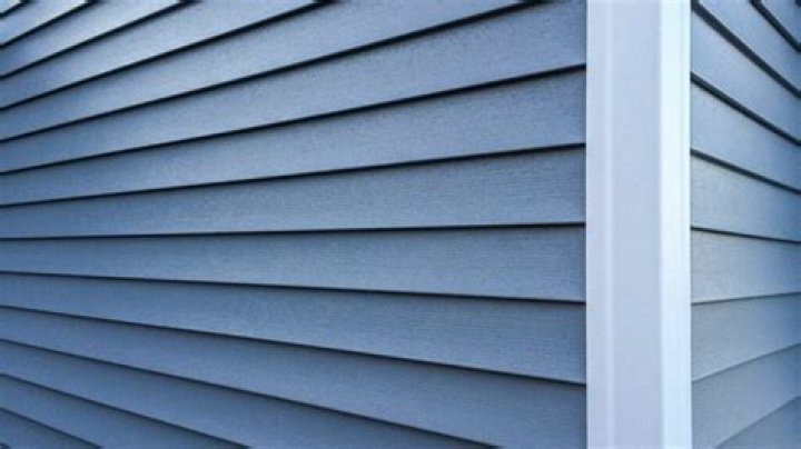 What is more expensive stucco or vinyl siding?