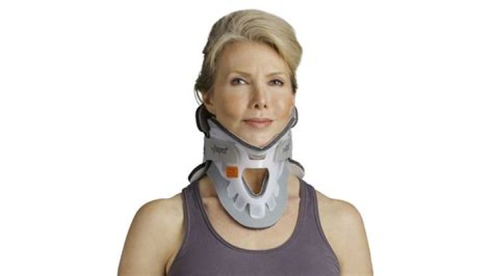 Why is Coraline's mom wearing a neck brace?